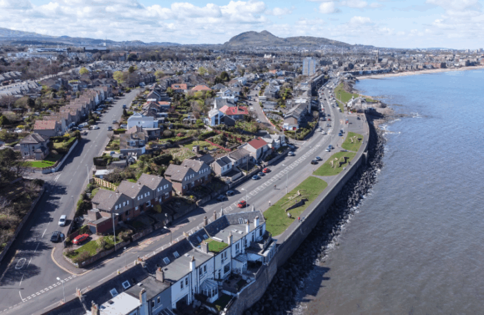 A view of Musselburgh in the sunshine. Edinburgh is visible in the distance and the Firth of Forth is on the right of the image.